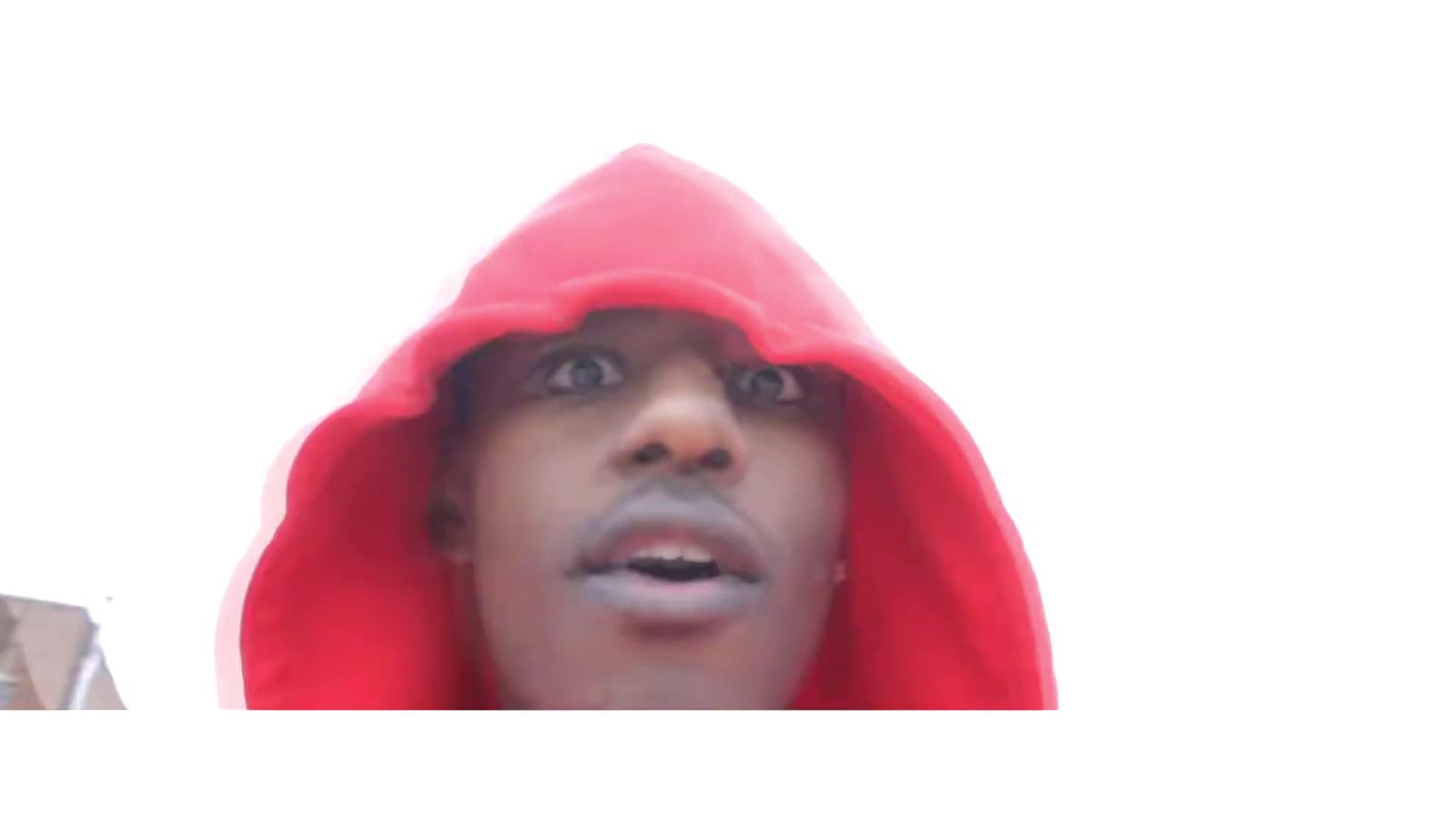 a man in a red hoodie making a face