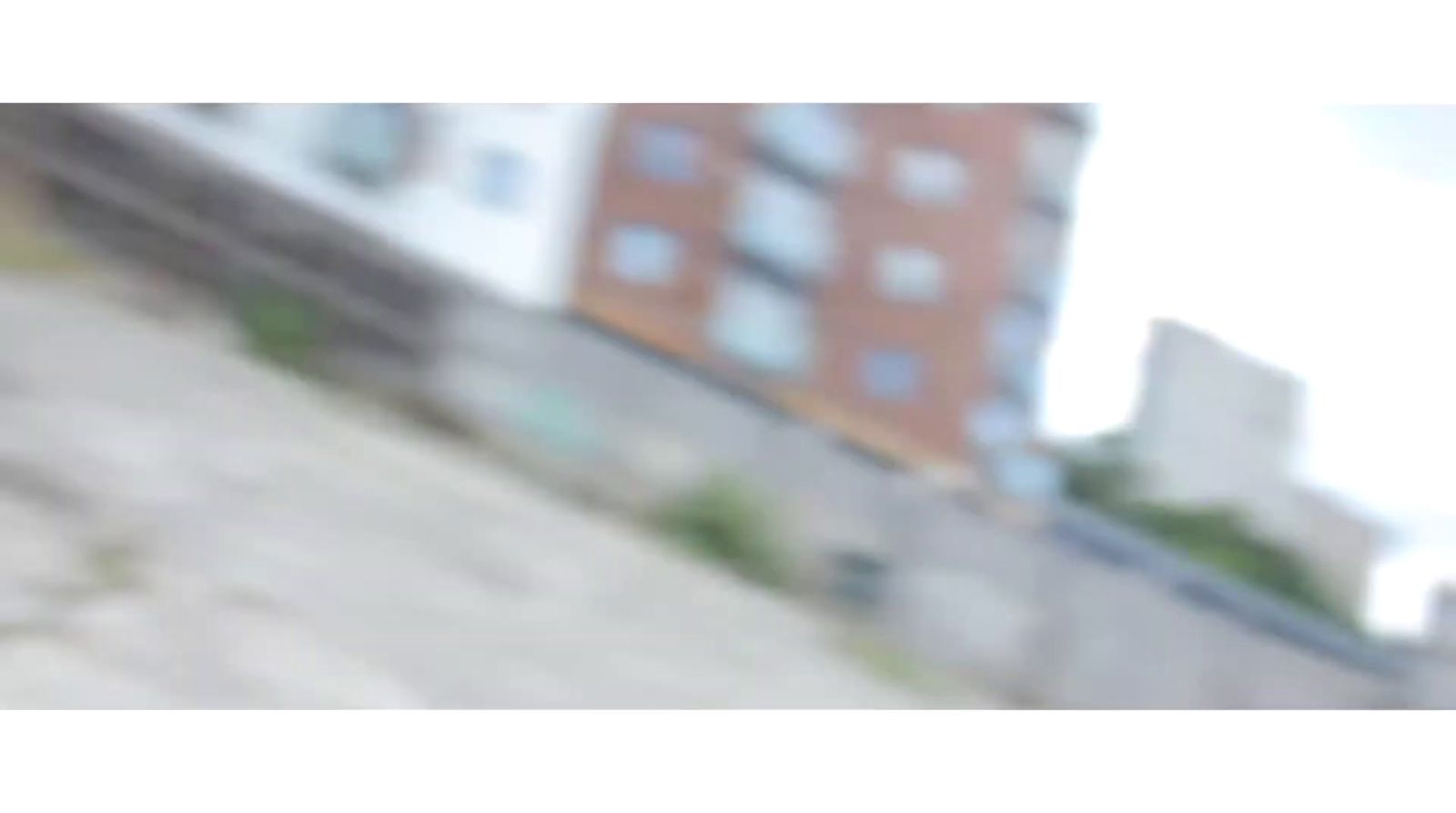 a blurry photo of a building and a wall