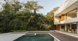 a house with a pool in front of it