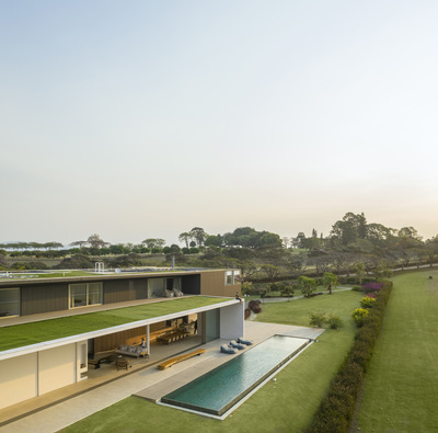 an aerial view of a house with a swimming pool