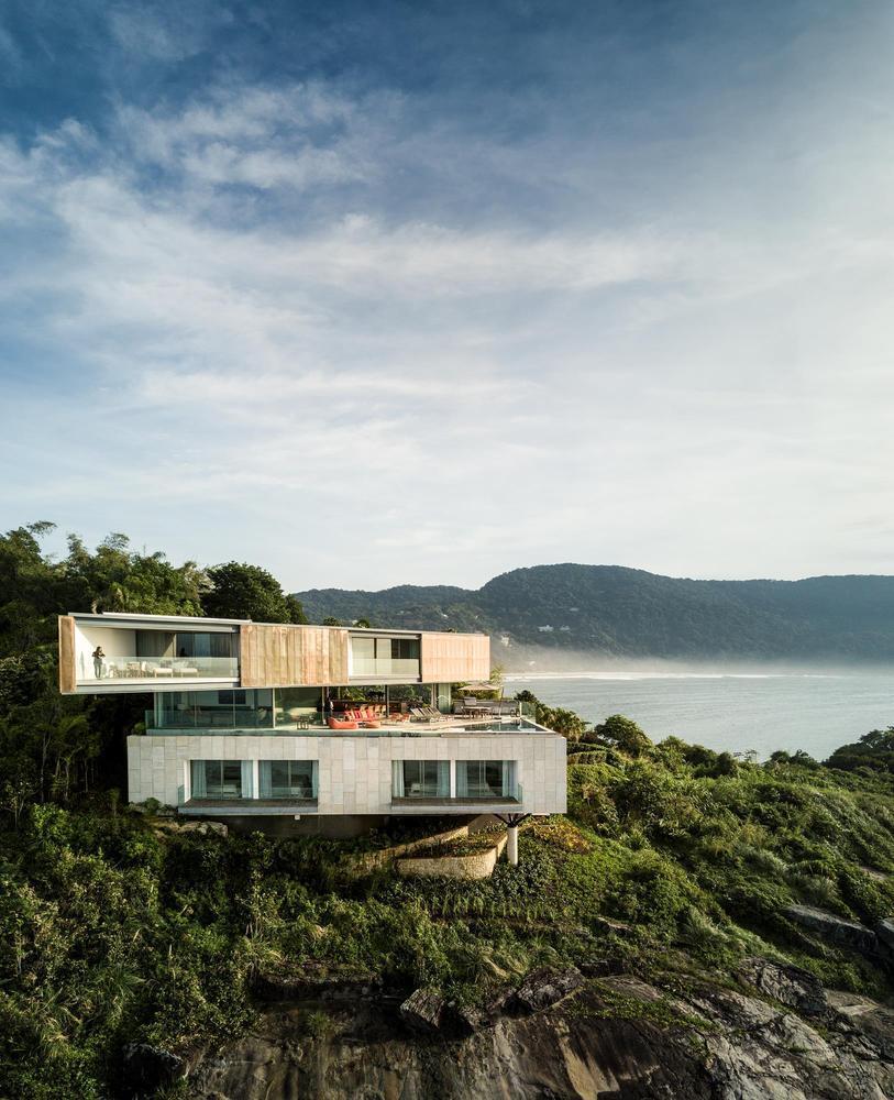 a house on a cliff overlooking the ocean