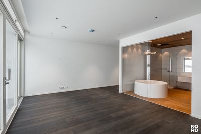 an empty room with a large round table in it