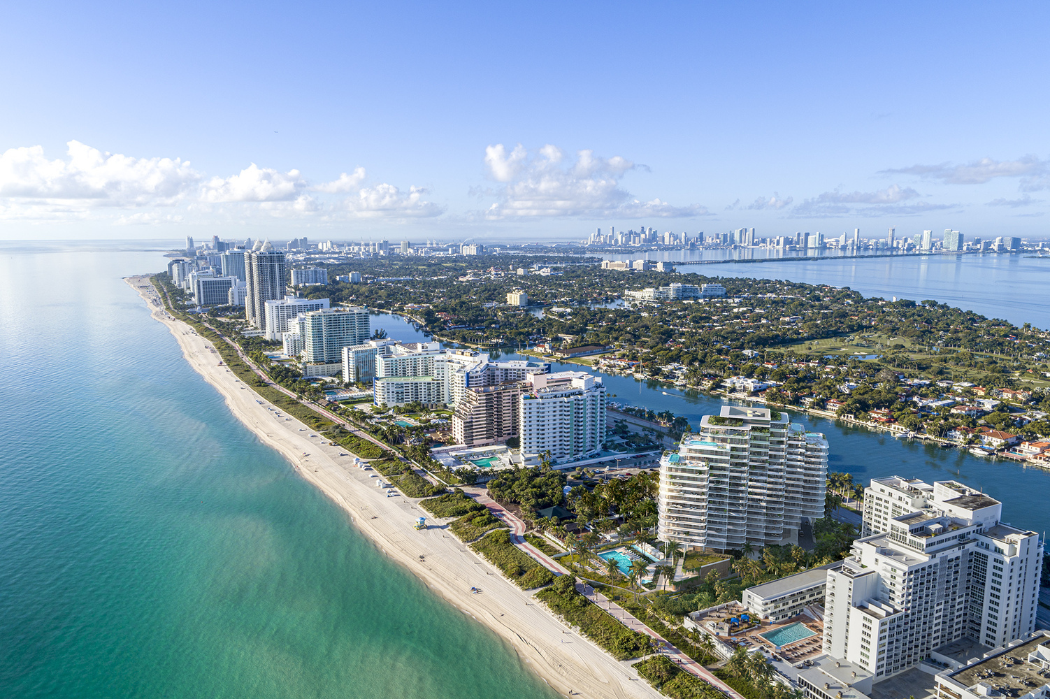 an aerial view of a city and the ocean