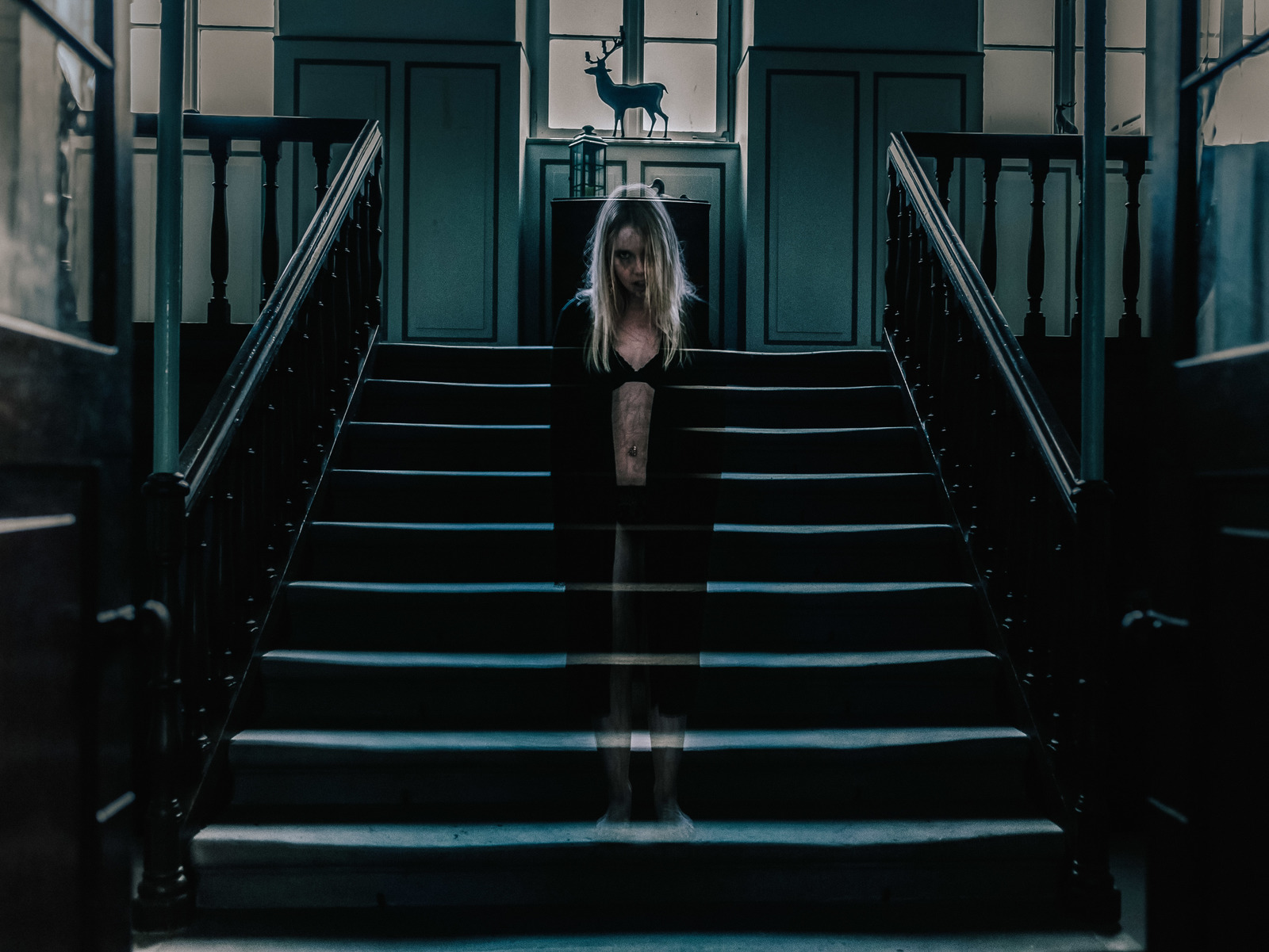 a woman standing on a set of stairs