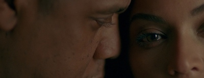 a close up of a man and a woman's face