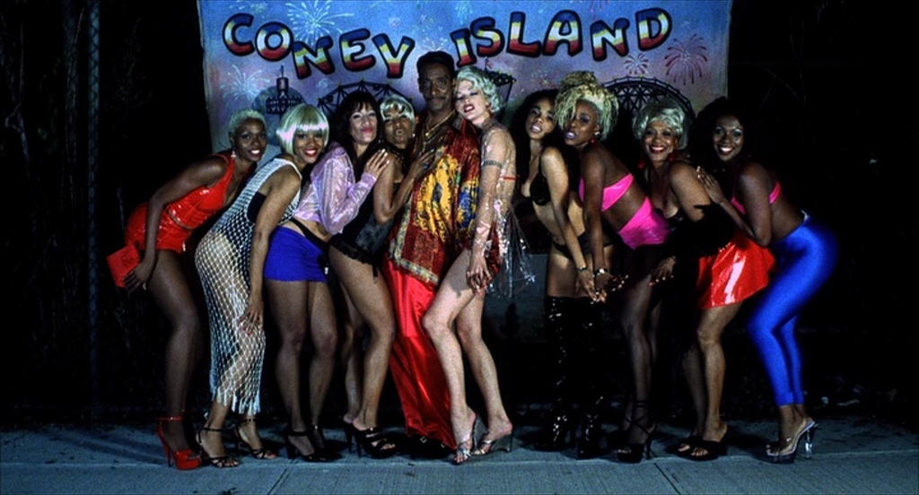 a group of women standing next to each other on a stage