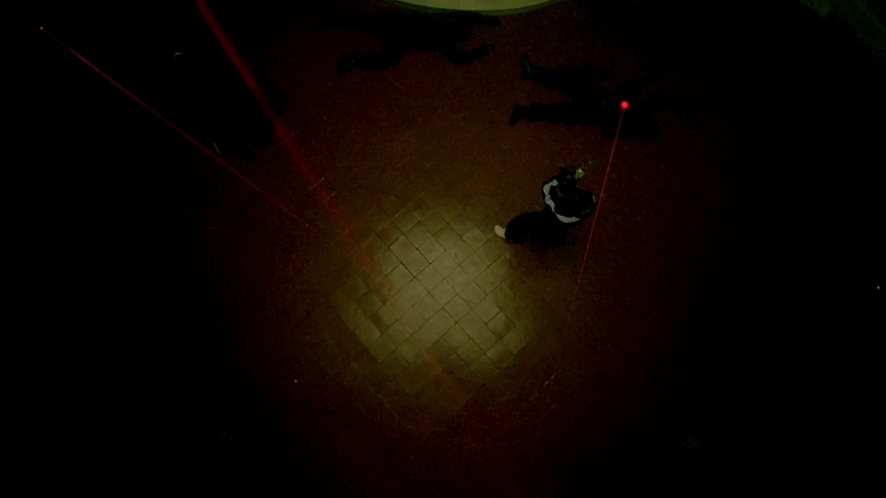 a person on a skateboard in a dark room