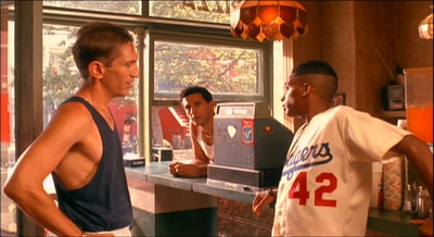 a group of men standing in front of a counter