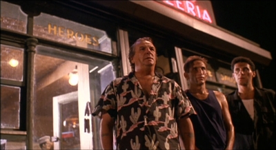 a group of men standing in front of a store