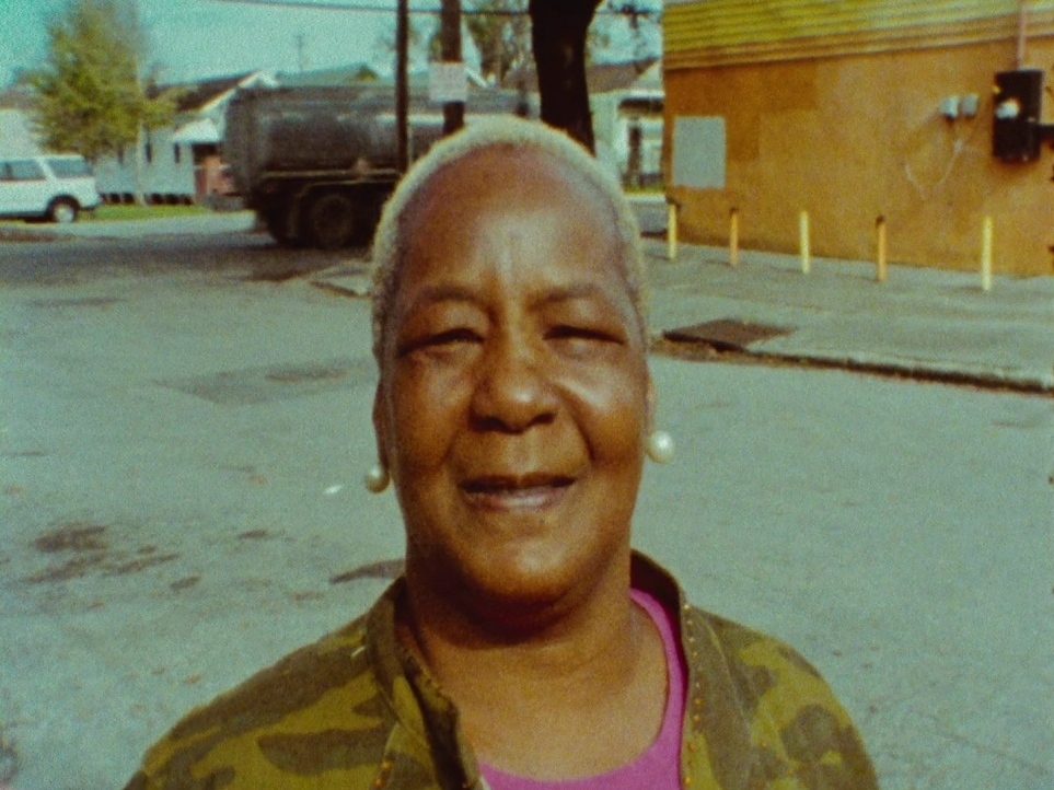 a woman standing in the middle of a street