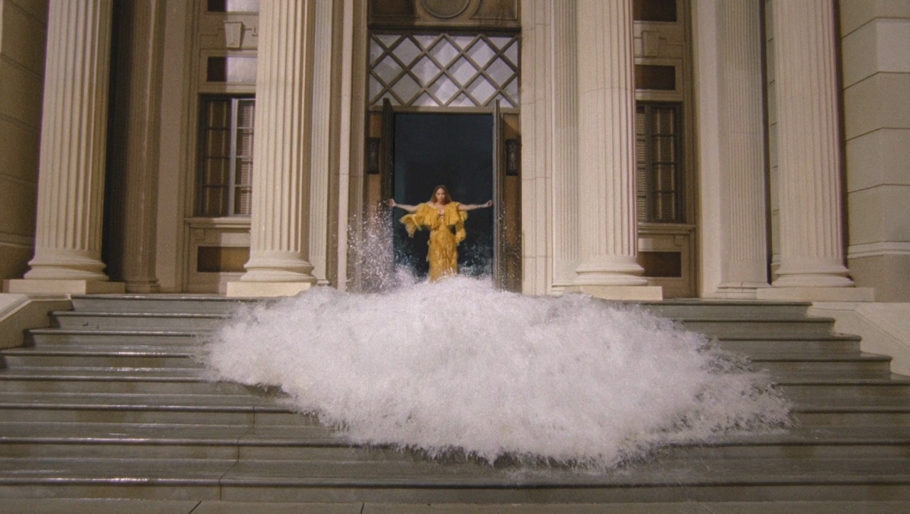 a person standing on a set of stairs in front of a building