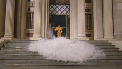 a person standing on a set of stairs in front of a building