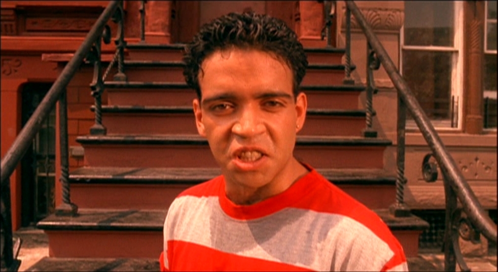 a man standing in front of a set of stairs