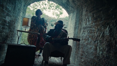 a couple of people that are sitting in a tunnel