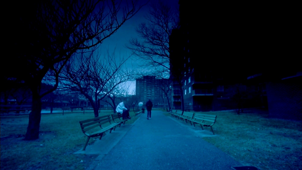 a couple of benches sitting on top of a sidewalk