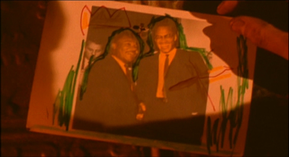 a picture of two men in suits on a piece of paper