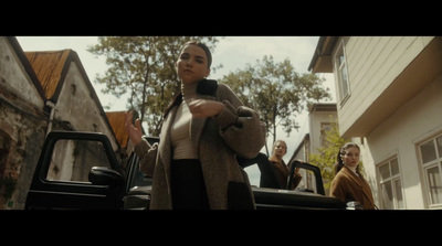 a woman standing in front of a truck