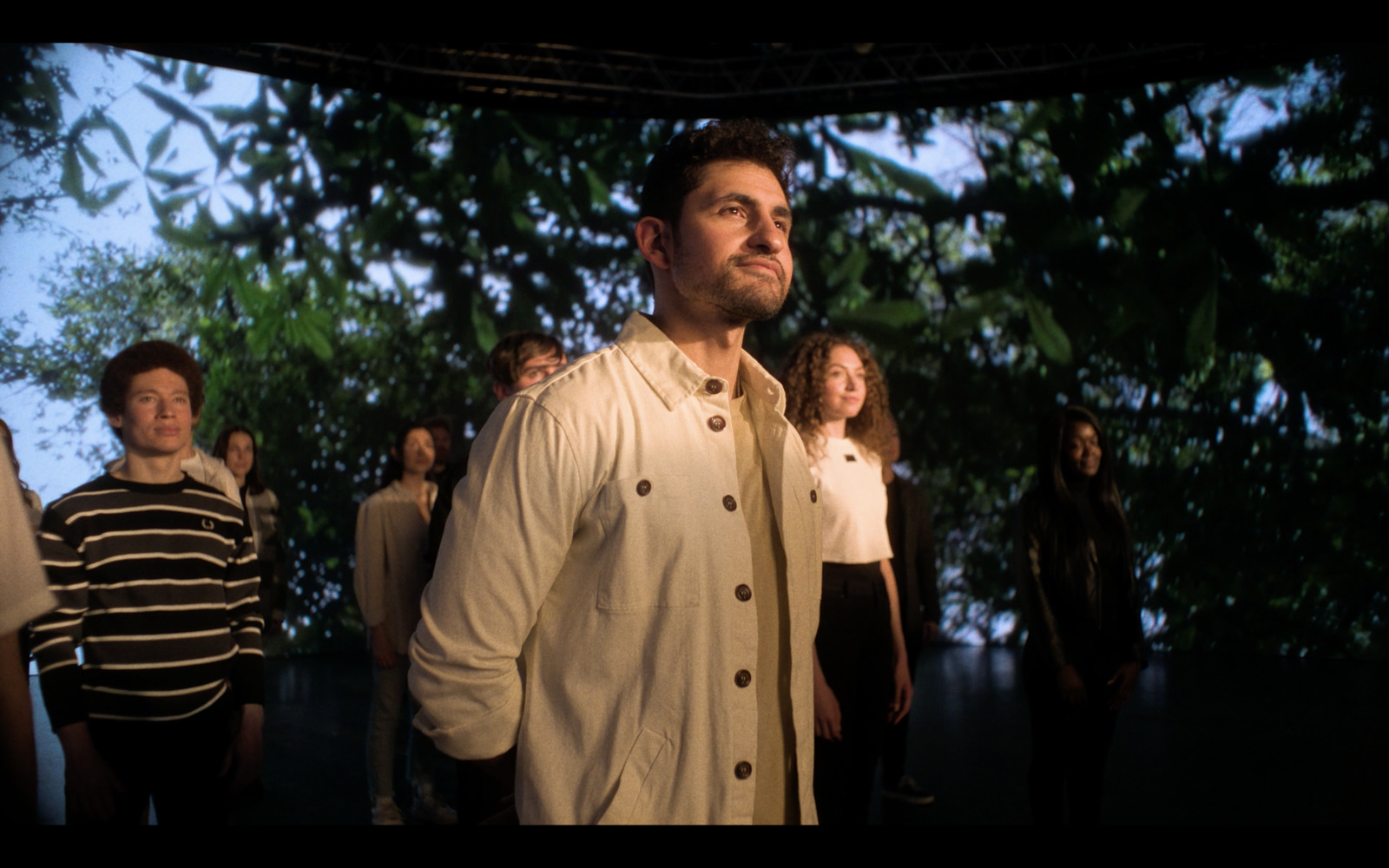 a man standing in front of a group of people