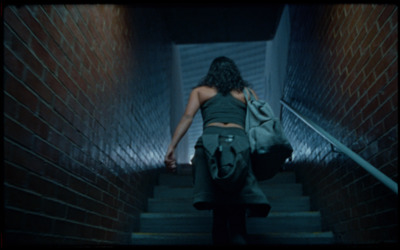 a woman walking down a flight of stairs