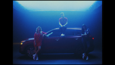 a group of people standing next to a car