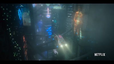 a futuristic city at night with neon lights