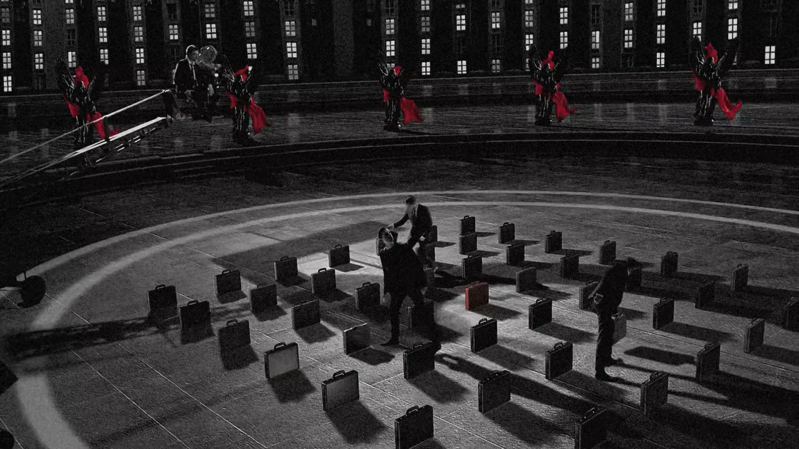 a black and white photo of people in a circle