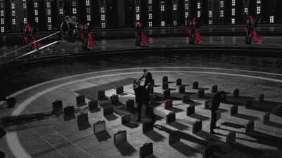 a black and white photo of people in a circle