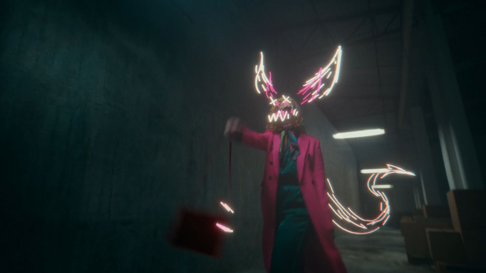 a person in a dark room with a neon rabbit mask