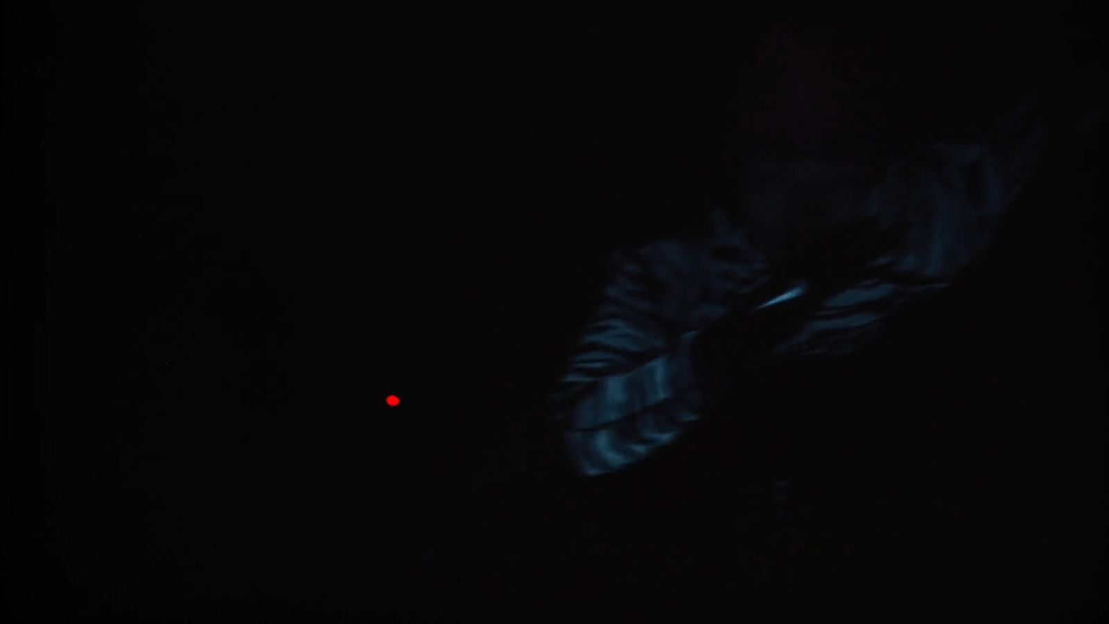 a blurry photo of a person in the dark