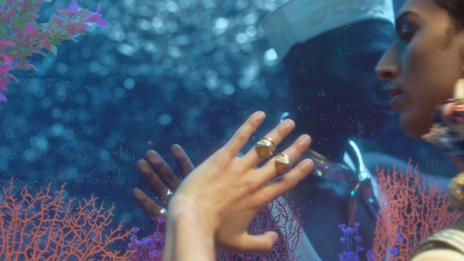 a close up of a person touching another person's hand