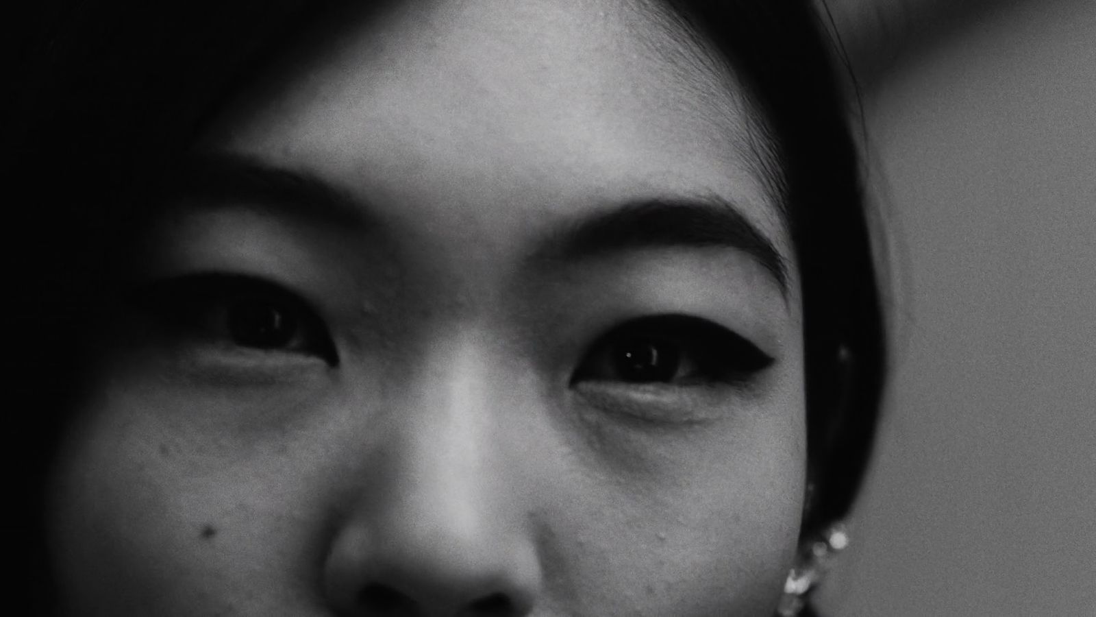 a black and white photo of a woman's face