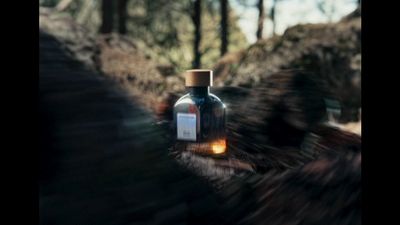 a bottle of alcohol sitting on top of a wooden table