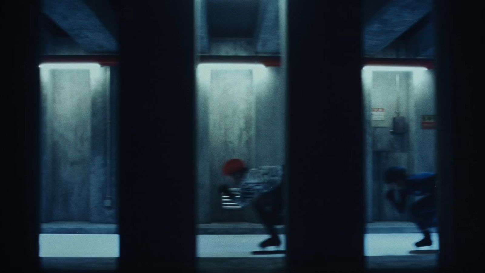 a person riding a skateboard down a hallway