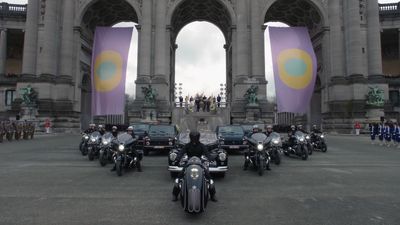 a group of motorcycles parked in front of a building