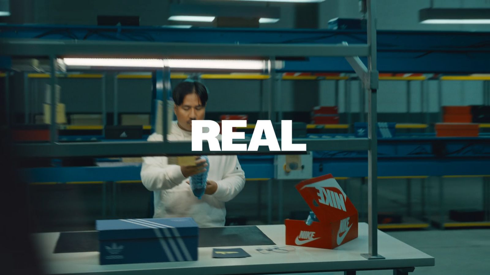 a man in a factory working on a box