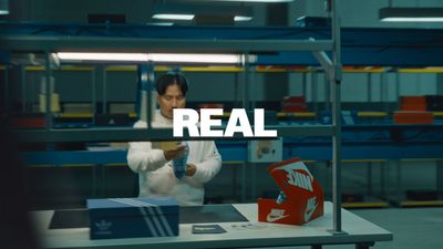 a man in a factory working on a box