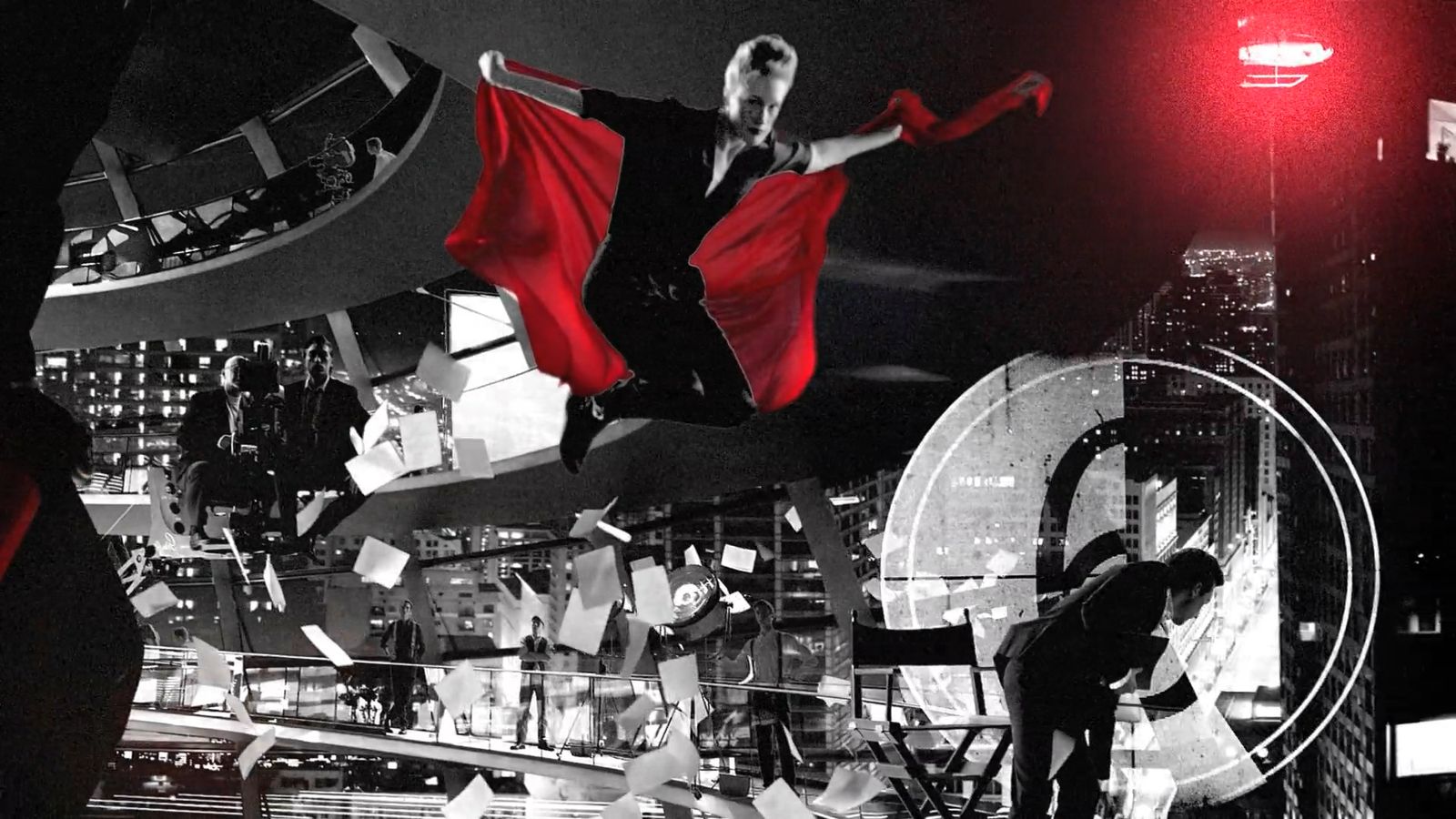 a woman in a black and red dress is flying through the air