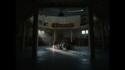 a group of people in a room with lights on