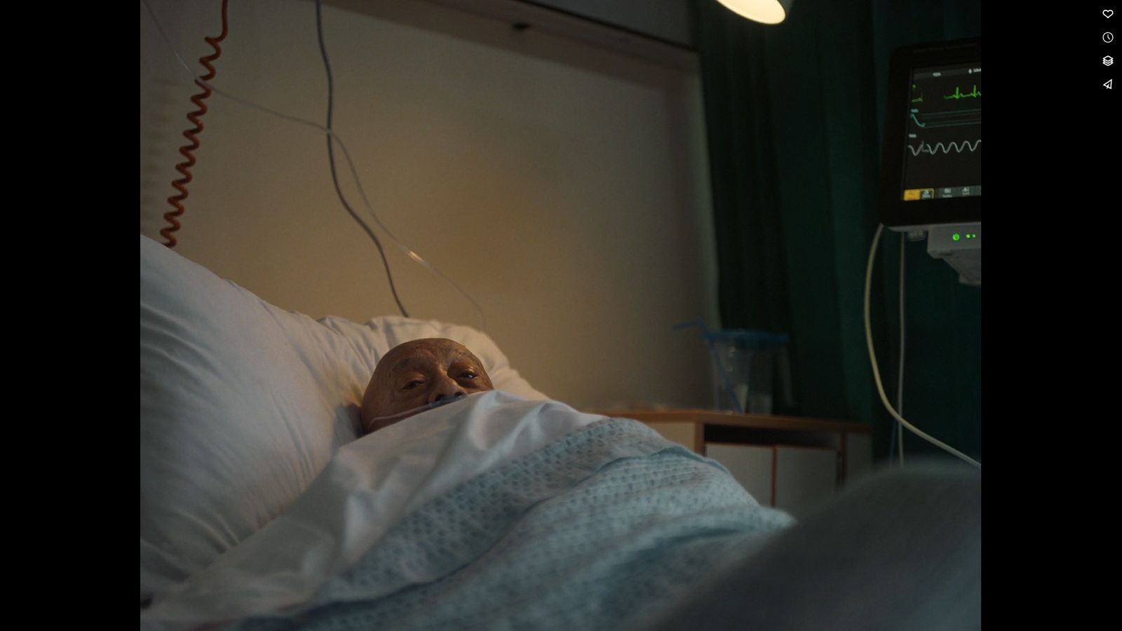 an old man laying in a hospital bed