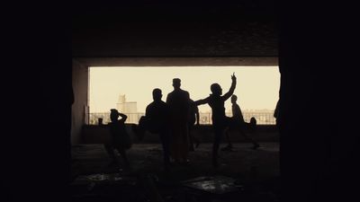 a group of people dancing in a dark room