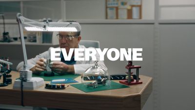 a man sitting at a desk working on a project