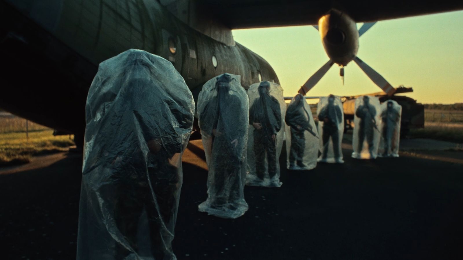 a group of people standing in front of an airplane