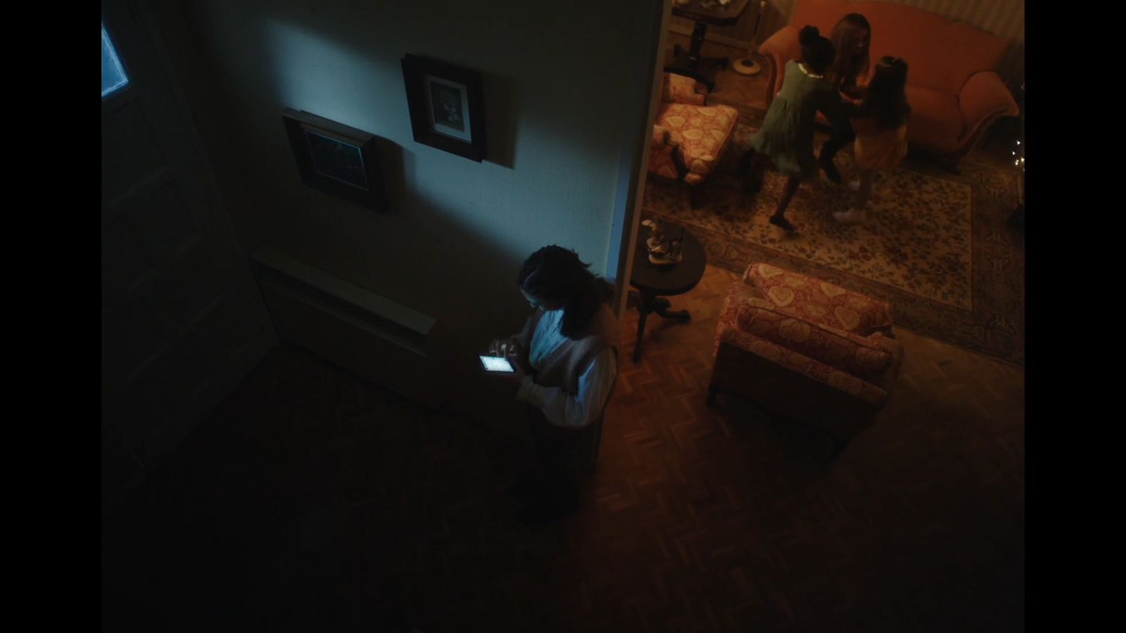 a woman sitting on a couch in a living room