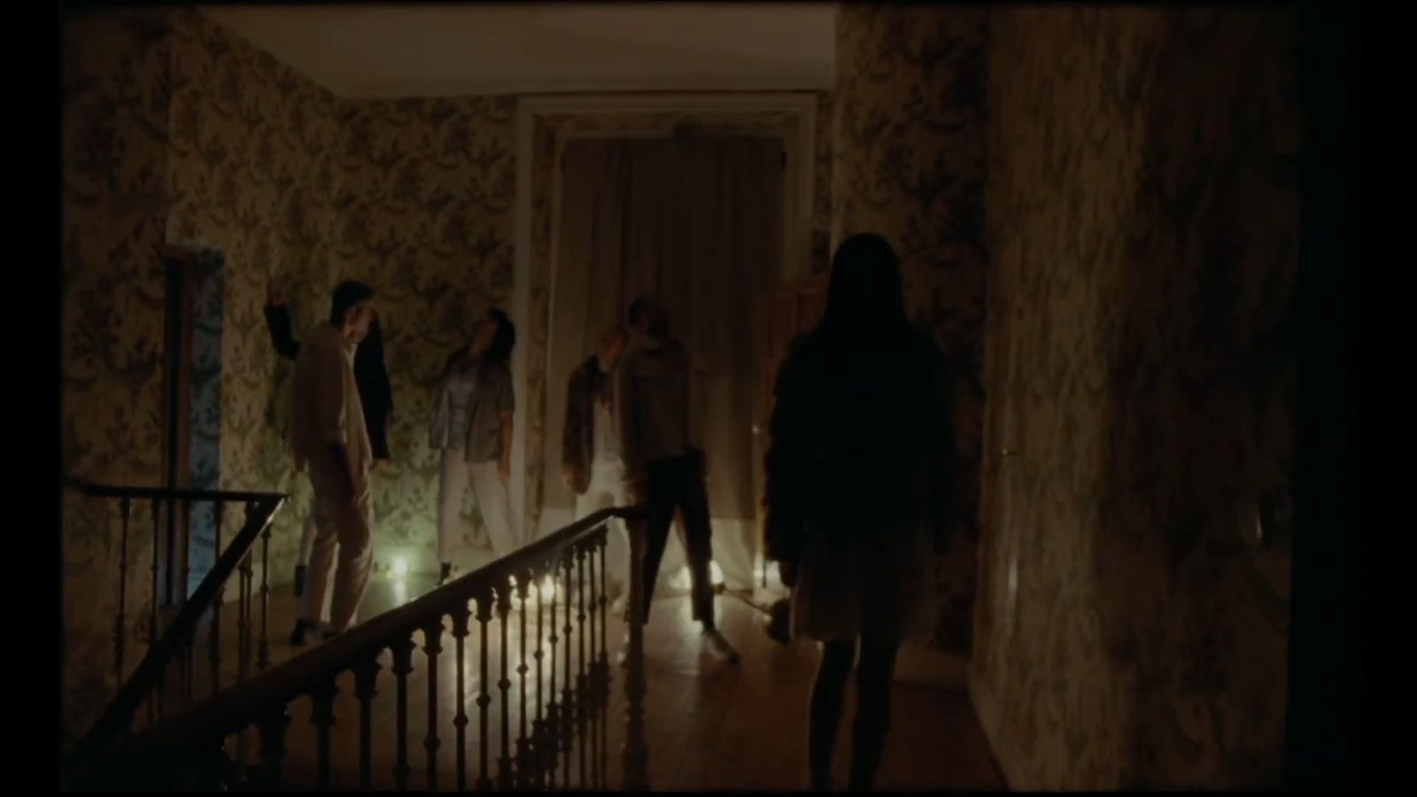 a group of people standing in a hallway