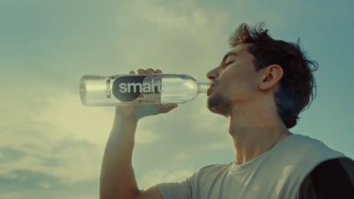 a man drinking from a smart water bottle