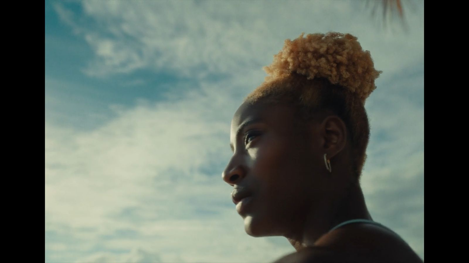 a woman with a flower in her hair