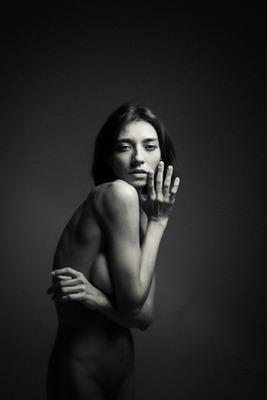 a naked woman posing for a black and white photo