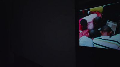 a group of people sitting in a dark room