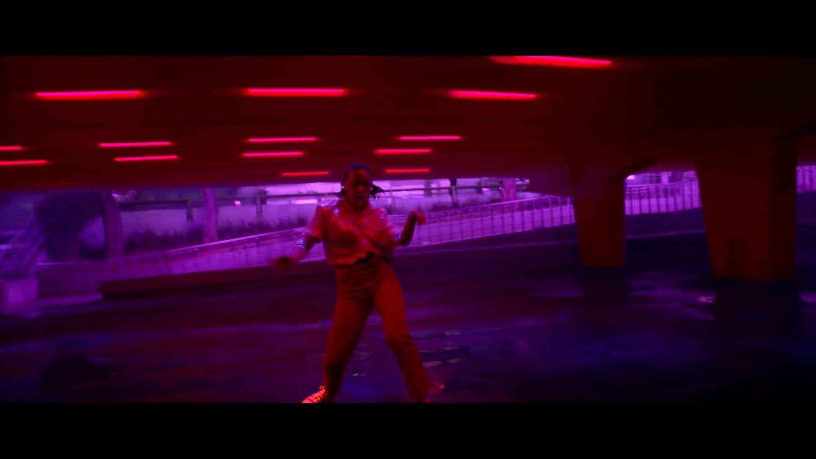 a man in a red suit is dancing