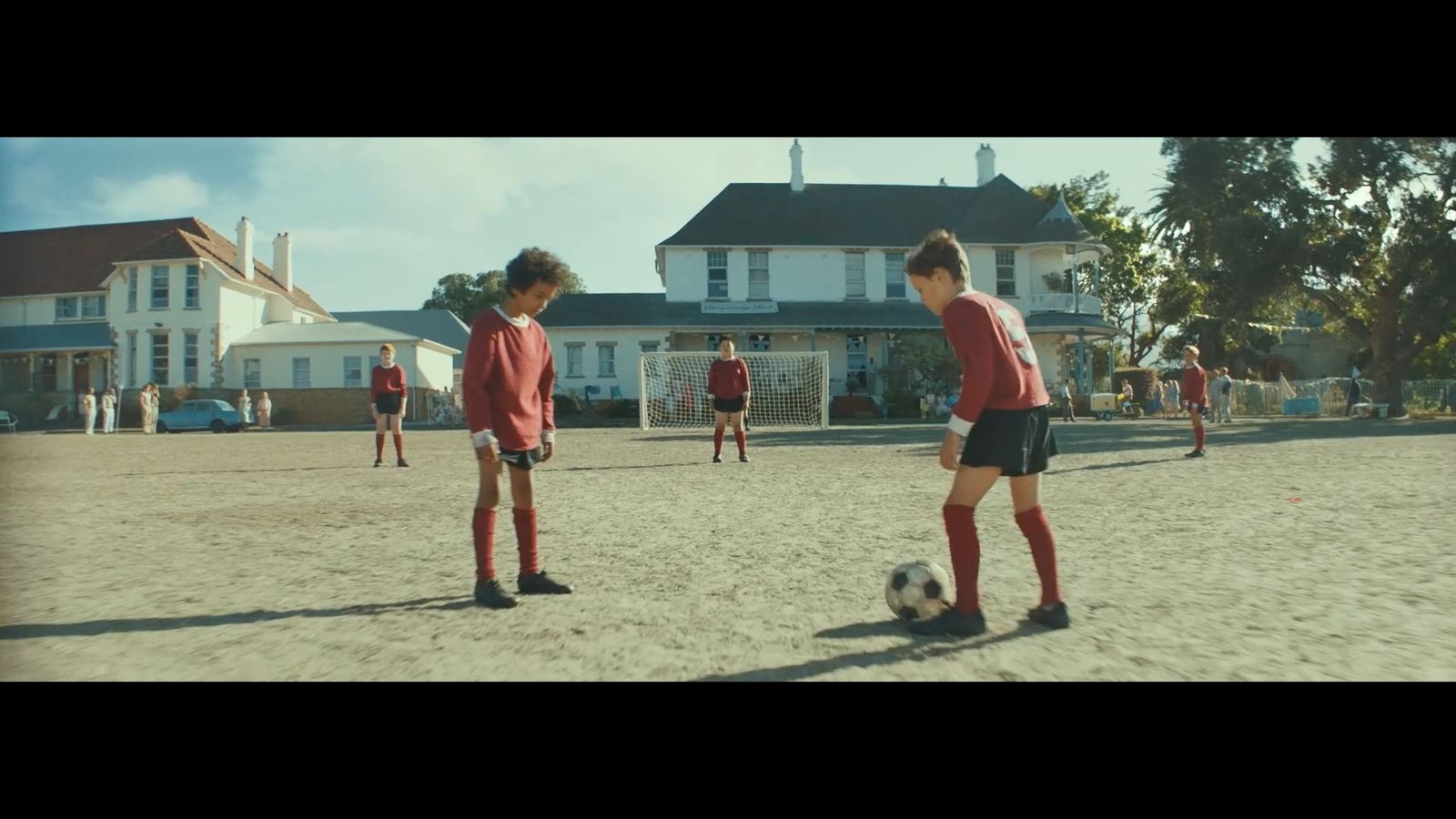 a group of young people playing a game of soccer